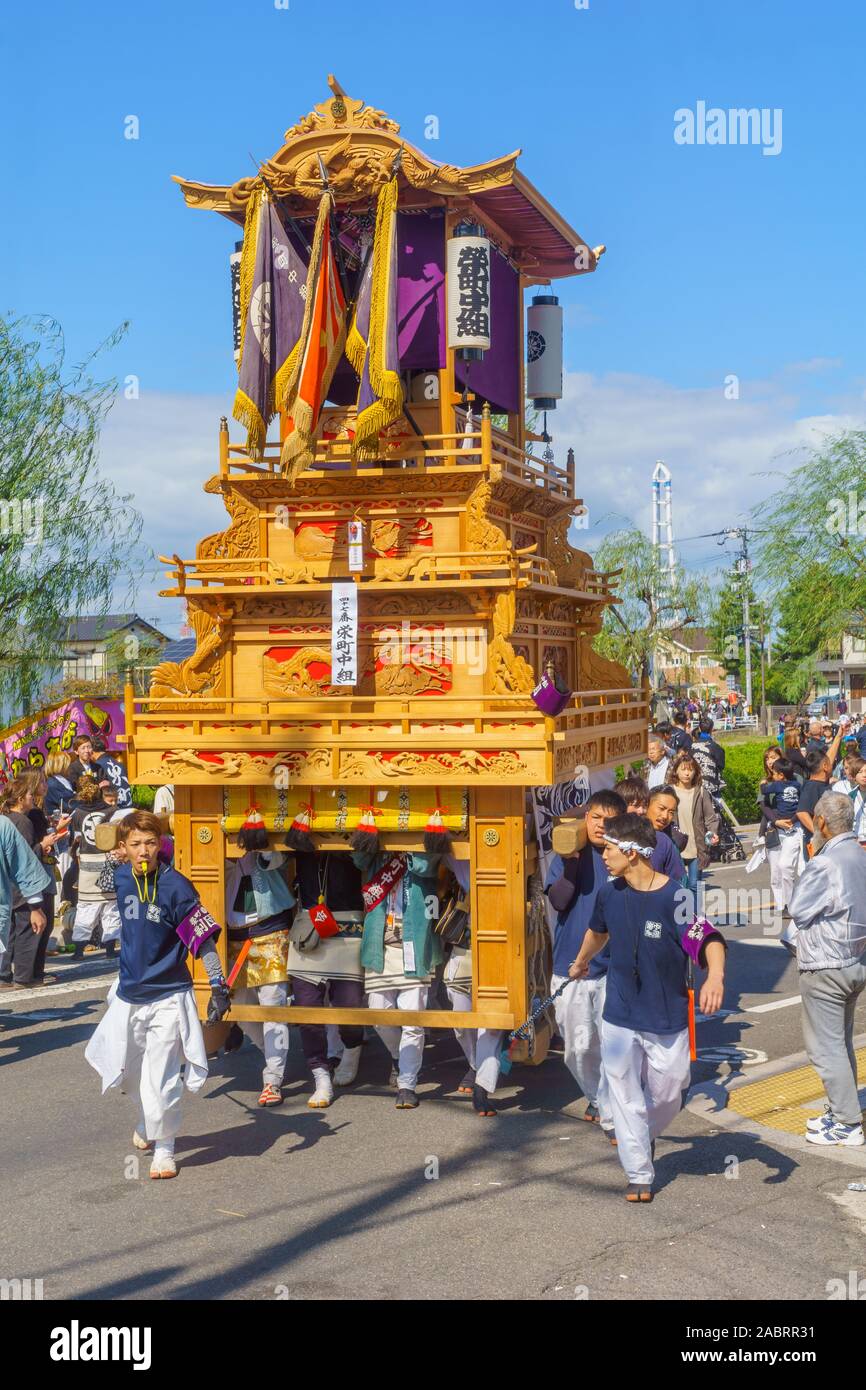 Saijo, Japan - October 16, 2019: Parade with participants carrying Danjiri floats (portable shrines), in the streets of the city center. Saijo Isono S Stock Photo