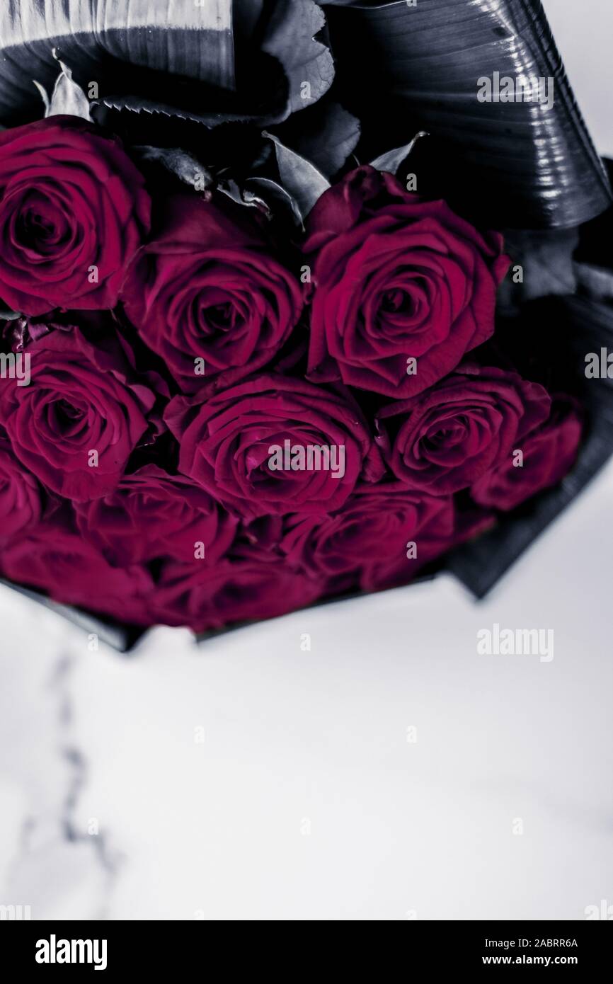 Gift for her, romantic relationship and floral design concept - Luxury  bouquet of maroon roses on marble background, beautiful flowers as holiday  love Stock Photo - Alamy