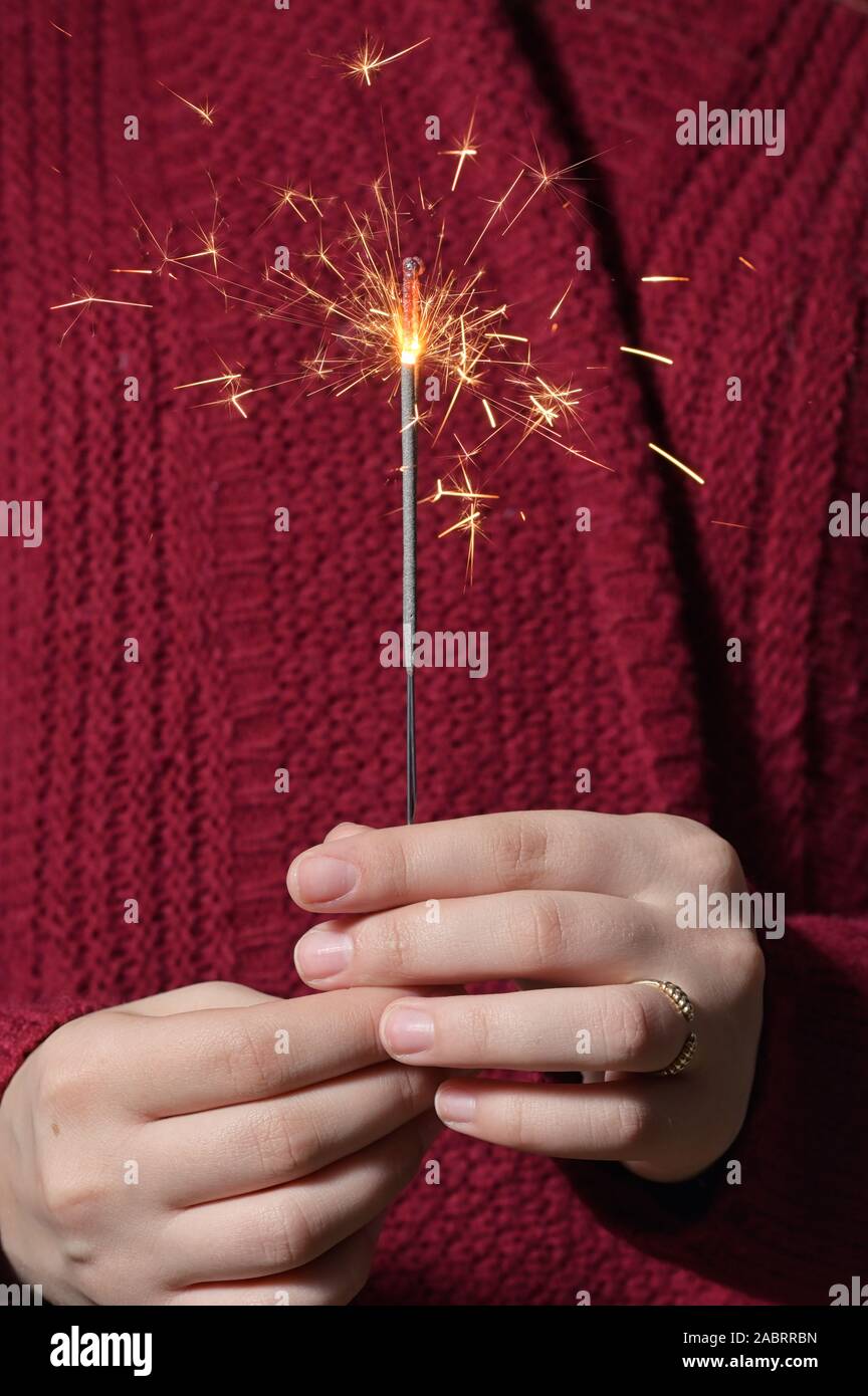 Hands Girl Holding Sparkles shoot in studio Stock Photo