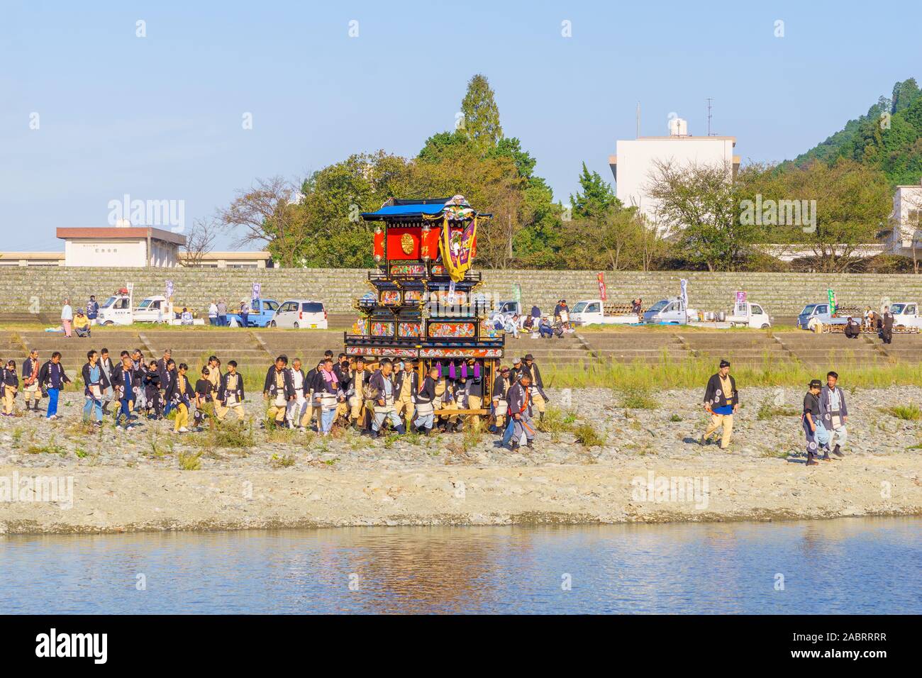Saijo, Japan - October 16, 2019: Gathering of participants and Danjiri (portable shrines), on the bank of the Kamogawa River. Saijo Isono Shrine Festi Stock Photo