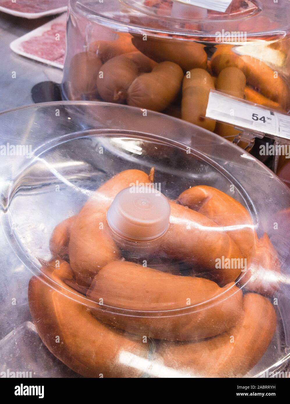 smoked sausages in refrigerated case Stock Photo Alamy