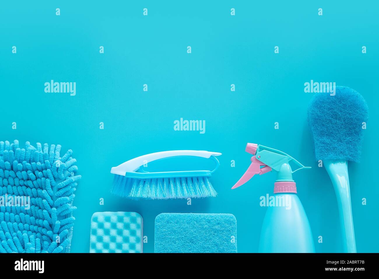 cleaning tools product supplies composition layout isolated on blue with copy space for template Stock Photo