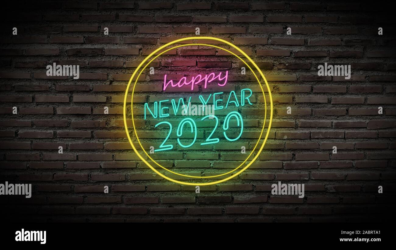 Happy new year shiny neon lamps sign glow on black brick wall. colorful sign board with colorful glowing text Happy new year 2020 in circle for party Stock Photo