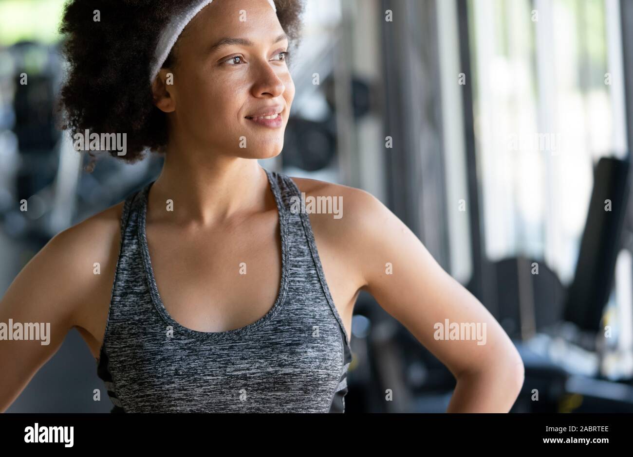 Portrait of young african fitness woman in gym Stock Photo