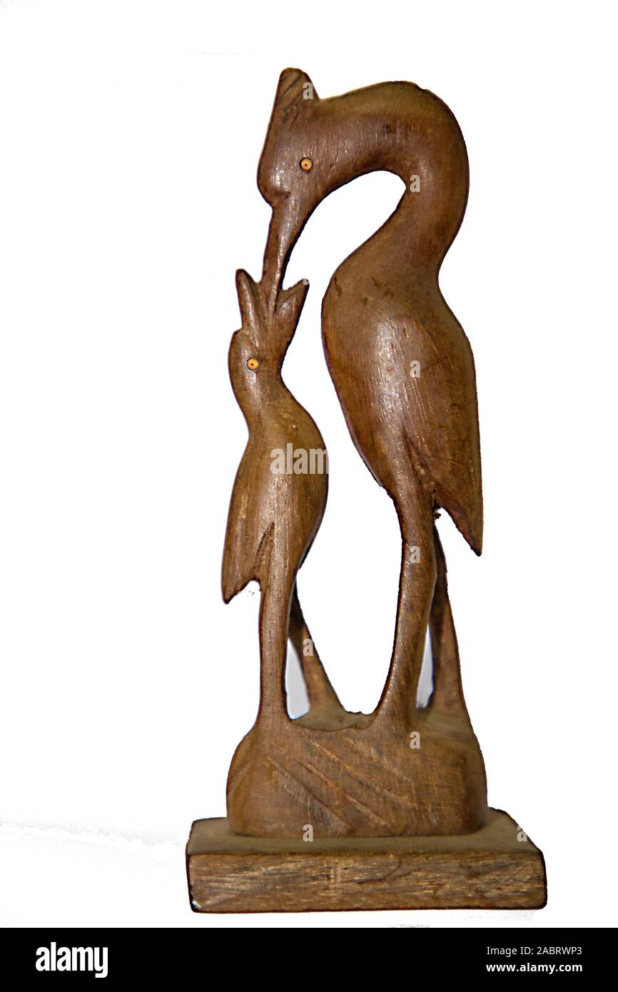 Wooden Art Statues, Hand carved wooden sculpture of a bird Stock Photo