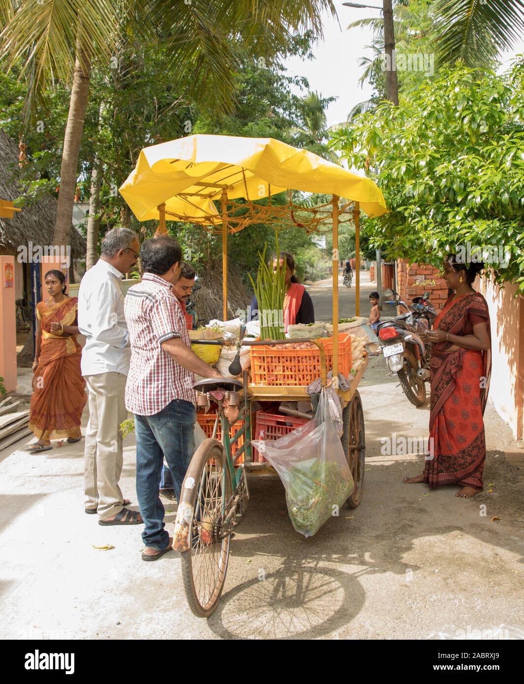 Vegetable street vendor with his mobile stand, outside street Stock Photo Alamy
