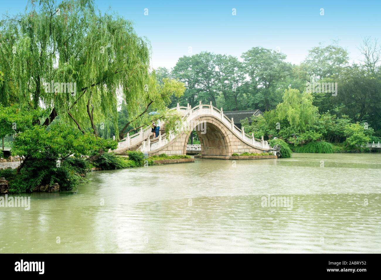 Chinese classical gardens in the rain: Slender West Lake, arch bridge and  couples, Yangzhou, China Stock Photo - Alamy, image size:1300x957