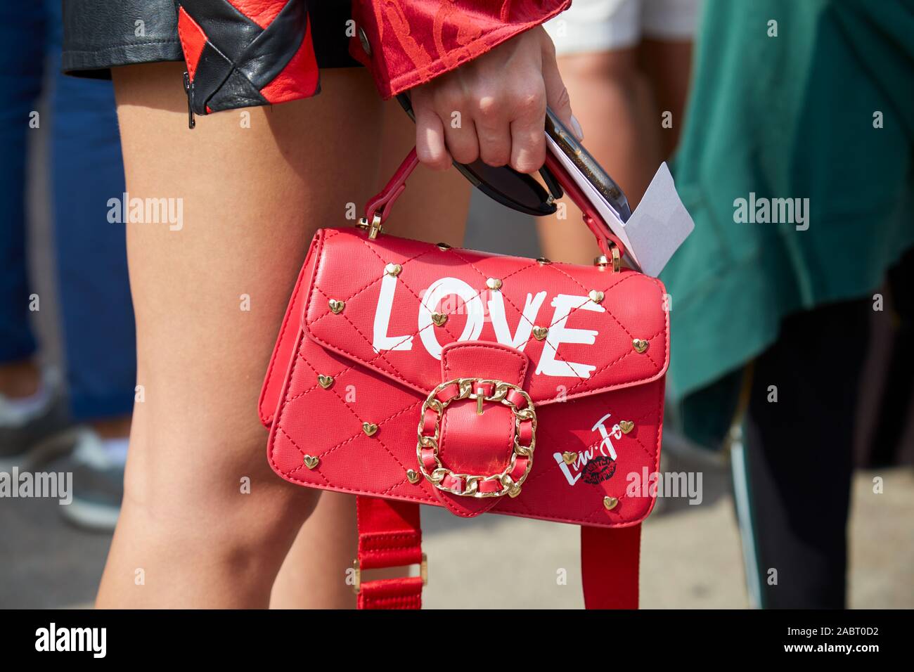MILAN, ITALY - SEPTEMBER 18, 2019: Woman with Liu Jo red leather Love bag  before Tiziano Guardini fashion show, Milan Fashion Week street style Stock  Photo - Alamy