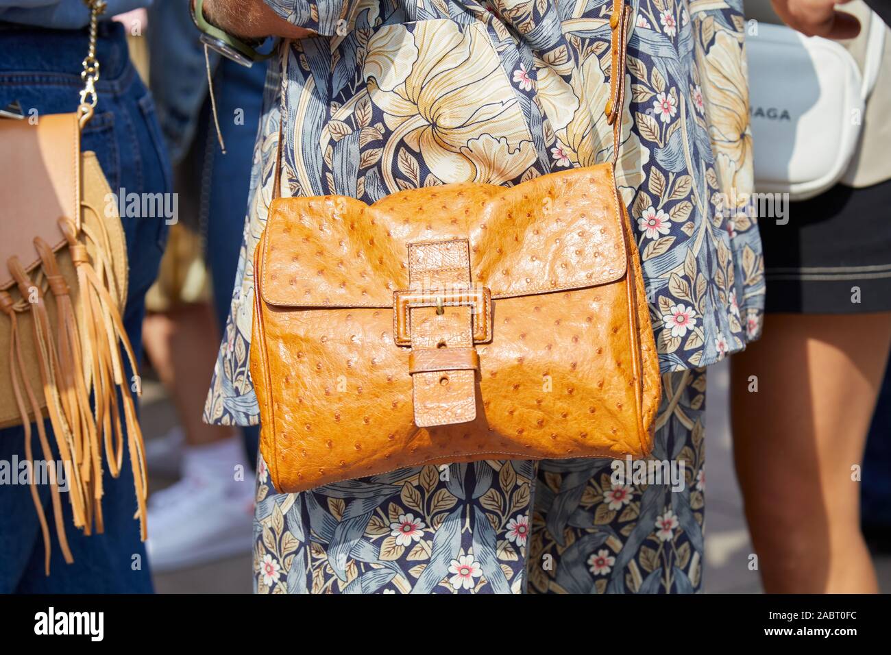 Woman with brown Louis Vuitton bag and pink dress with sequins before  Tiziano Guardini fashion show, Milan Fashion Week street style – Stock  Editorial Photo © AndreaA. #326209302