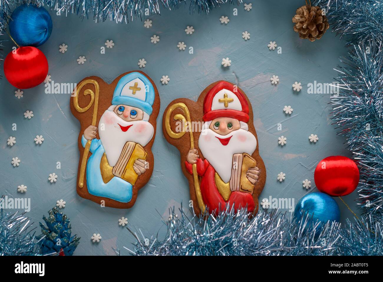 Gingerbread cookies for the feast of St. Nicholas on a light blue background, Closeup Stock Photo