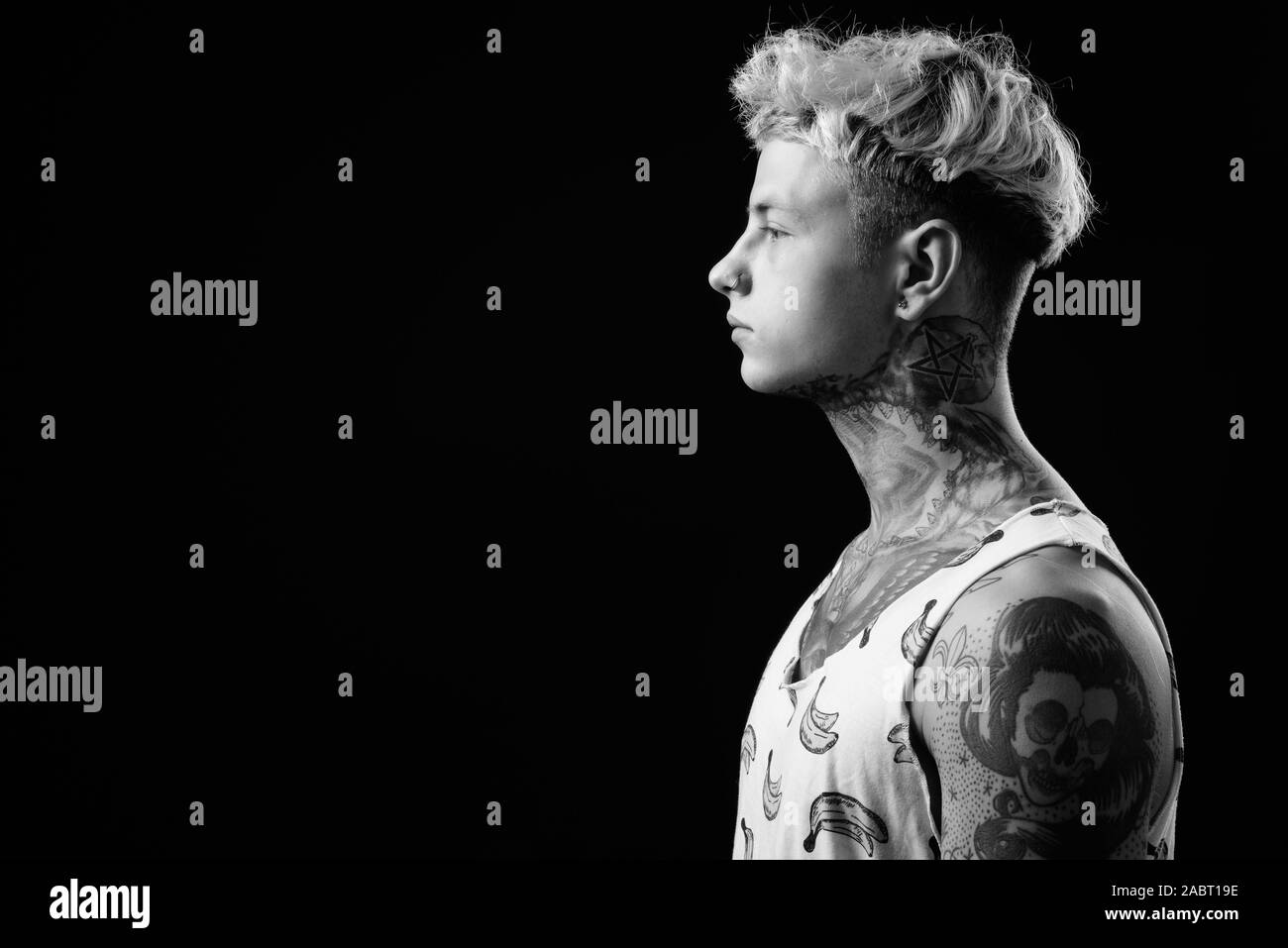 Young Handsome Rebellious Man With Blond Hair In Black And White