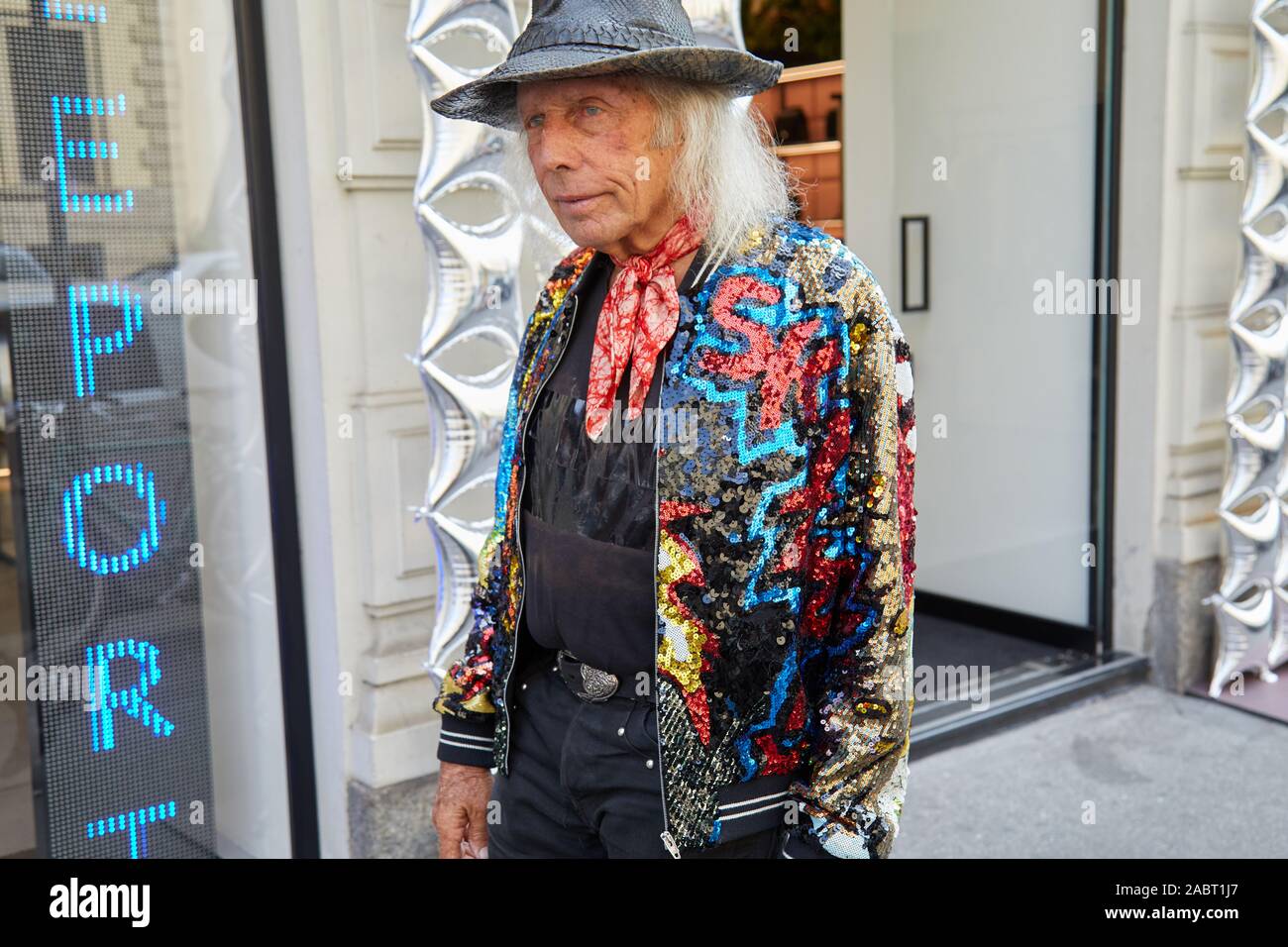 MILAN ITALY SEPTEMBER 18 2019 Man with sequin jacket and reptile leather hat before Peter