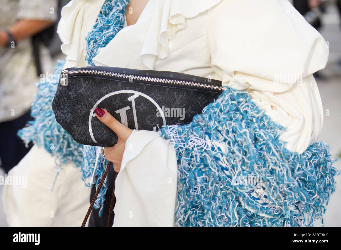 Louis Vuitton lady's luxury travel handbag detail scarf and sunglasses  Stock Photo - Alamy