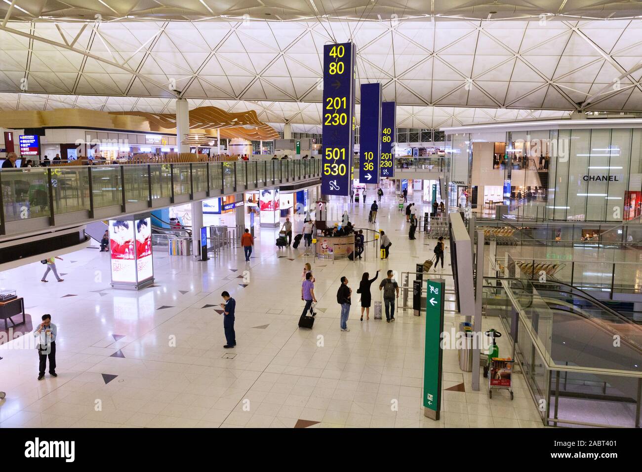 Hong Kong airport - people in the main international terminal (Terminal 1); Hong kong international airport, or Chek Lap Kok airport, Hong Kong Asia Stock Photo