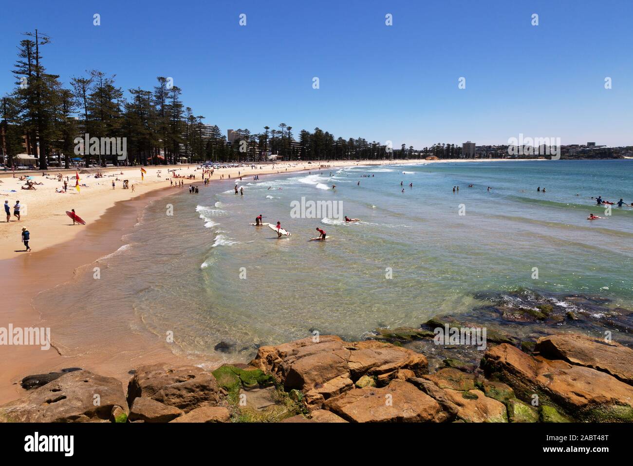 Manly Beach Sydney Australia - view of the beach on a sunny day with people swimming and sunbathing in summer. Manly, Sydney New South Wales Australia Stock Photo