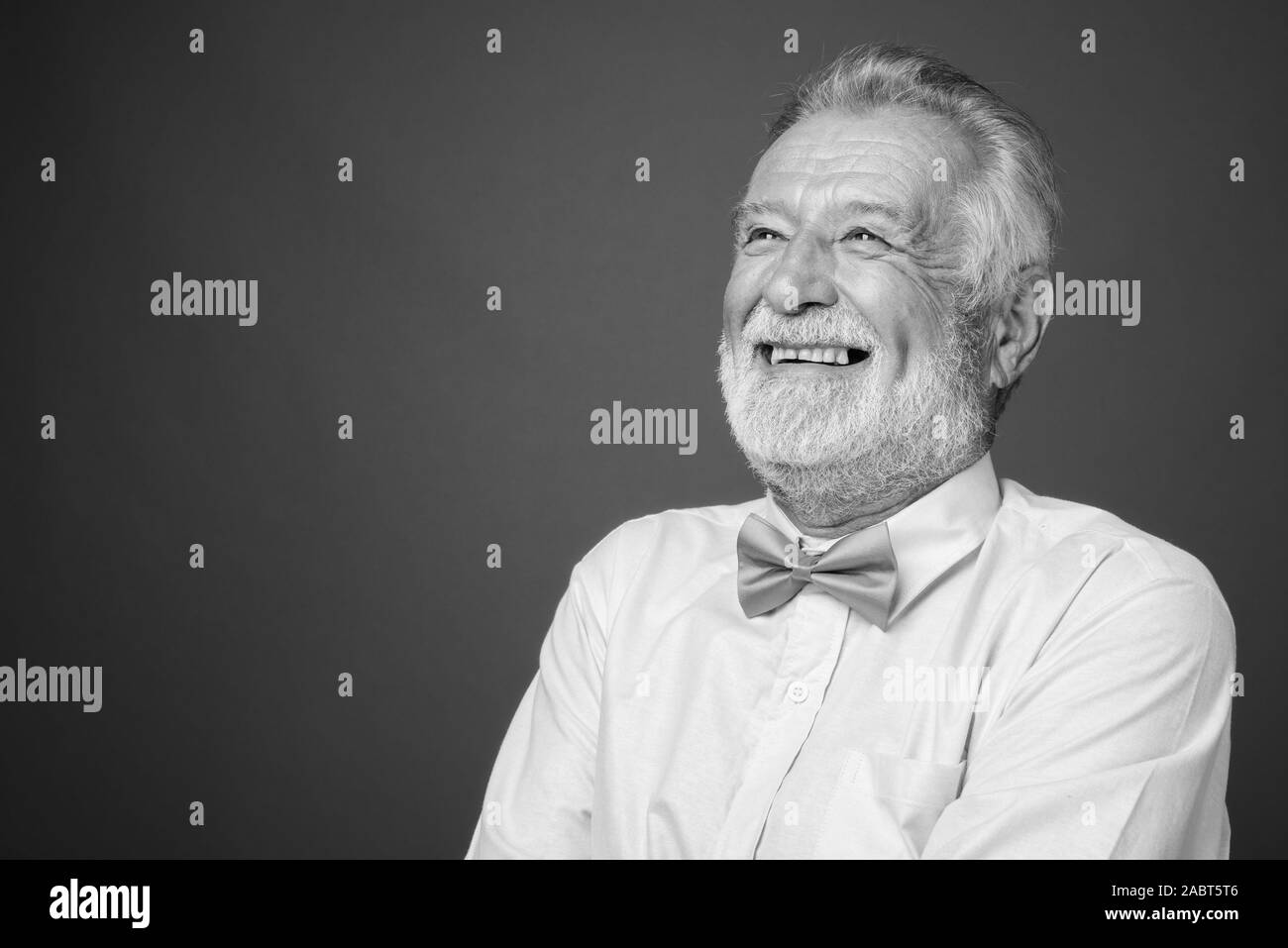 Handsome bearded senior man wearing stylish clothes in black and white Stock Photo