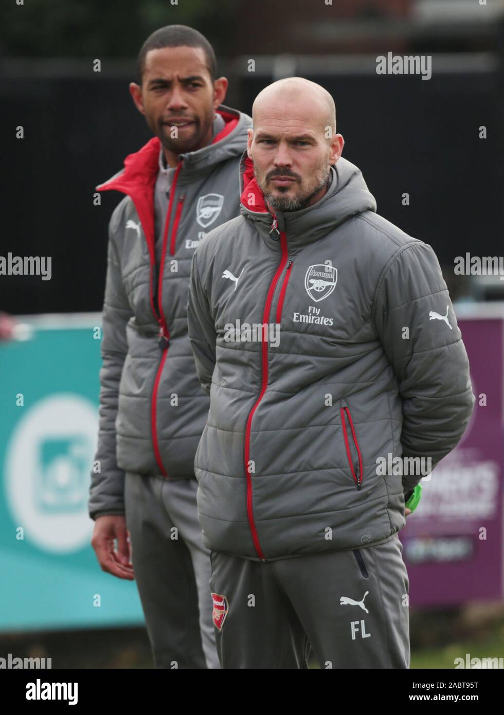 L-R Arsenal's U19s Academy Head Foundation phase coach Ryan Garry and Ex Arsenal player, Freddie Ljungberg, now working for their Academy during UEFA Youth League match between Arsenal against Paris Saint-Germain at Boreham Wood Football Club on November 22nd 2016 Credit: Action Foto Sport/Alamy Live News Stock Photo