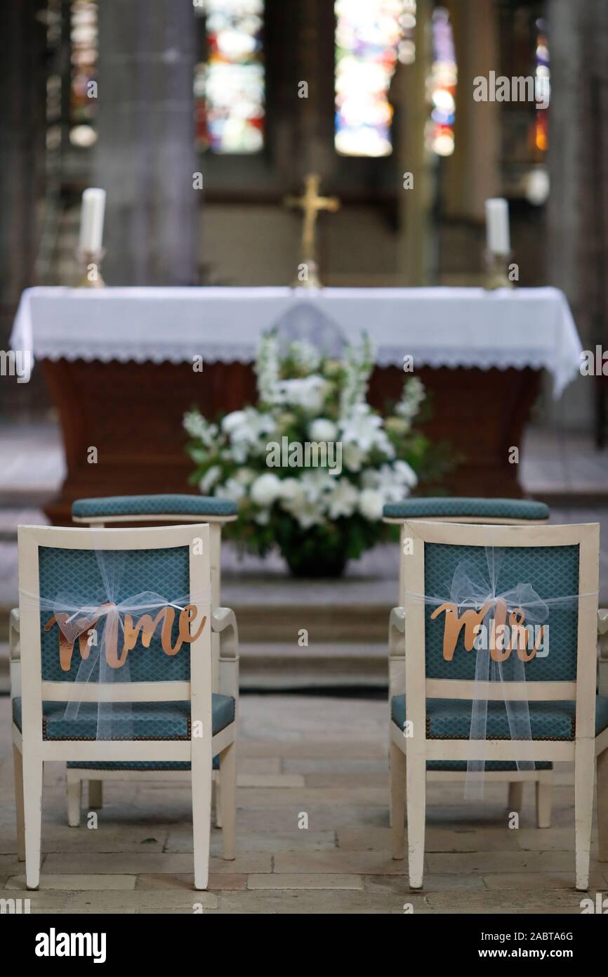Wedding  in a catholic church. Chairs Mr and Mrs for bride and groom.  France. Stock Photo