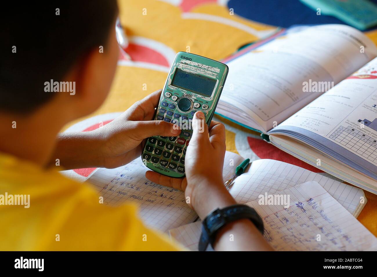 Boy calculator hi-res stock photography and images - Alamy