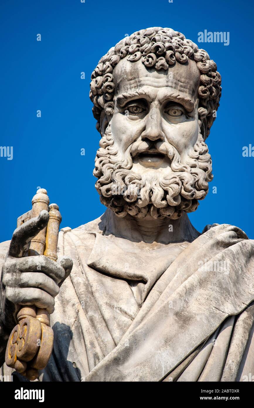 Statue of Saint Peter holding the key of heaven outside St Peter's basilica, Vatican city. Stock Photo