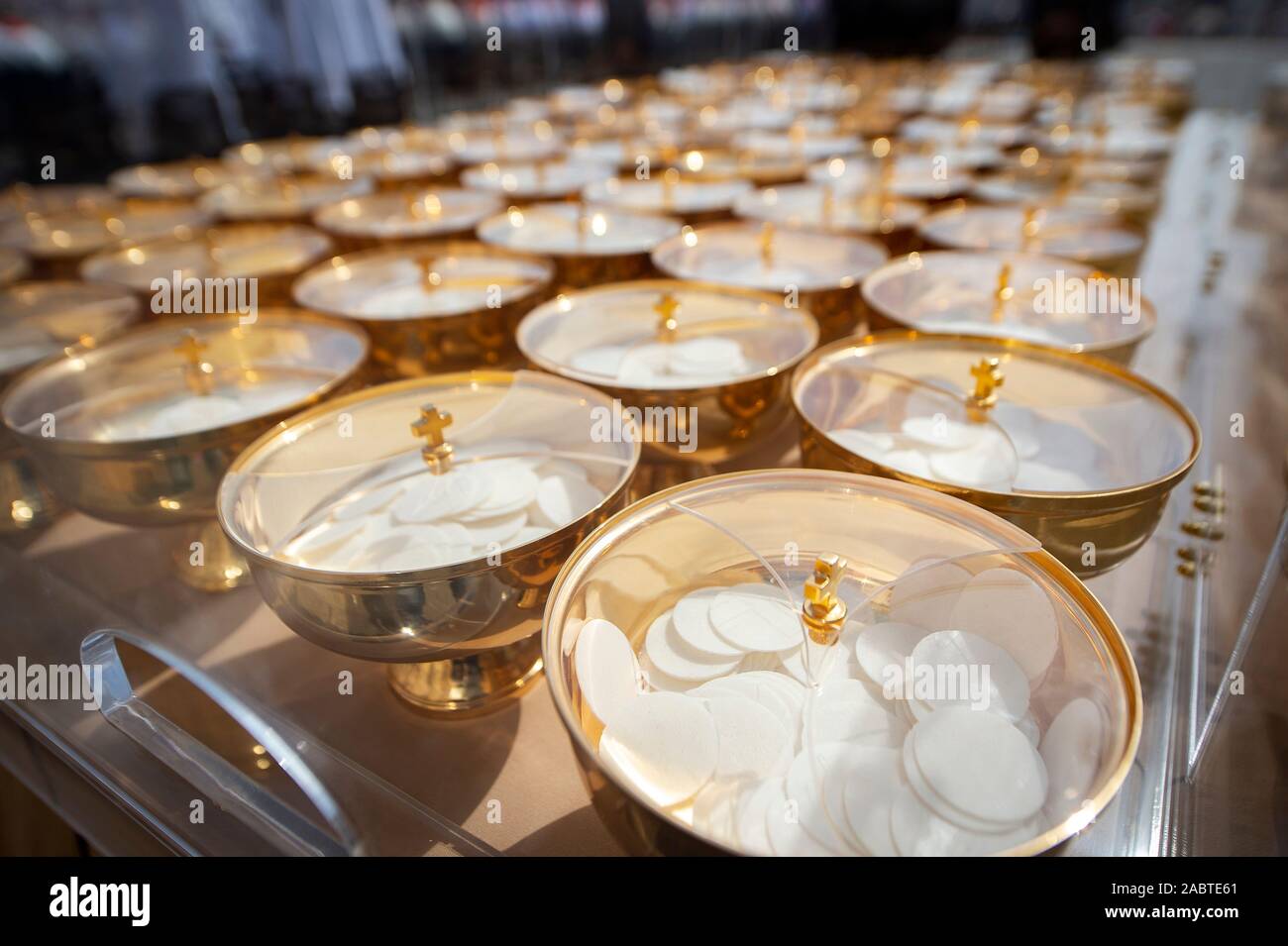 Ciboriums full of communion wafers during Pentecost Holy Mass in St