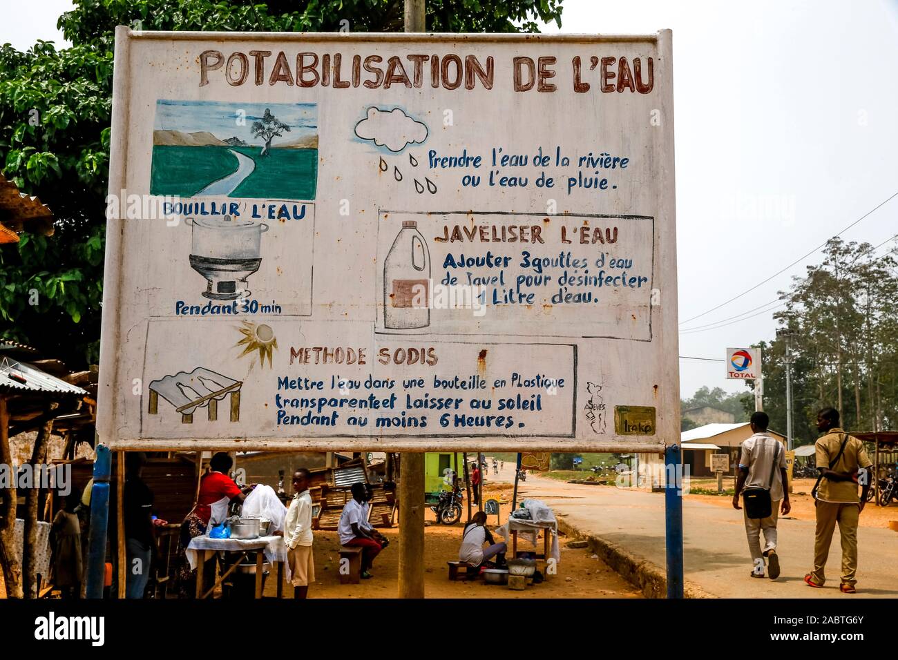 Sign explaining how to make water drinkable in Danyi-Apéyémé, Togo. Stock Photo