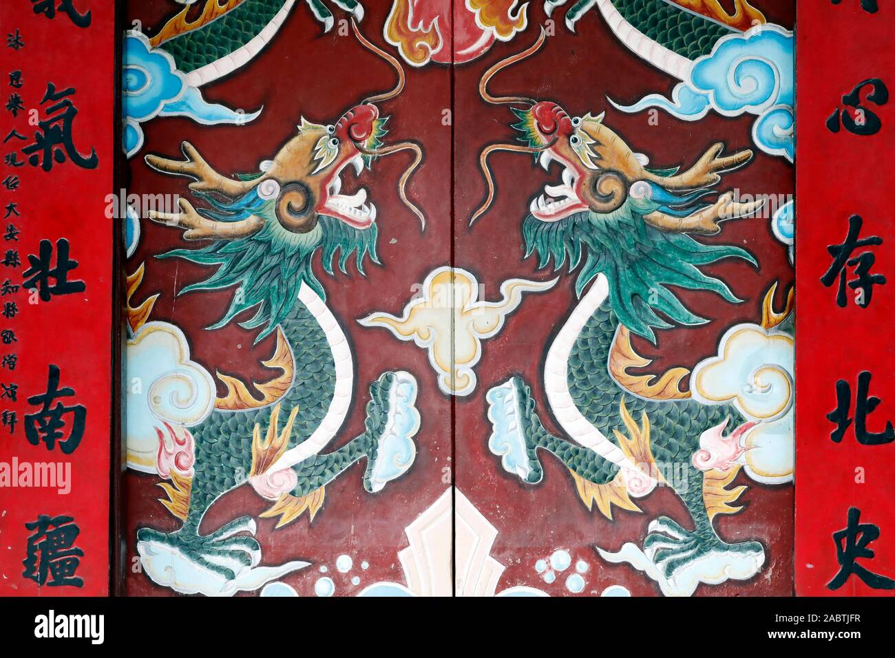 Drawings of dragons at the entrance to the 17th-century Chinese Quan Cong Temple.  Hoi An. Vietnam. Stock Photo