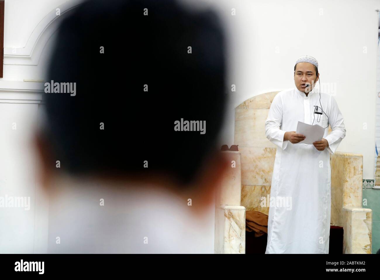 The friday prayer (jummah). Imam giving the sermon ( Khutbah). Masjid Al Noor mosque. Hanoi The friday prayer (jummah). Imam giving the sermon ( Khutbah). Masjid Al Noor mosque. Hanoi