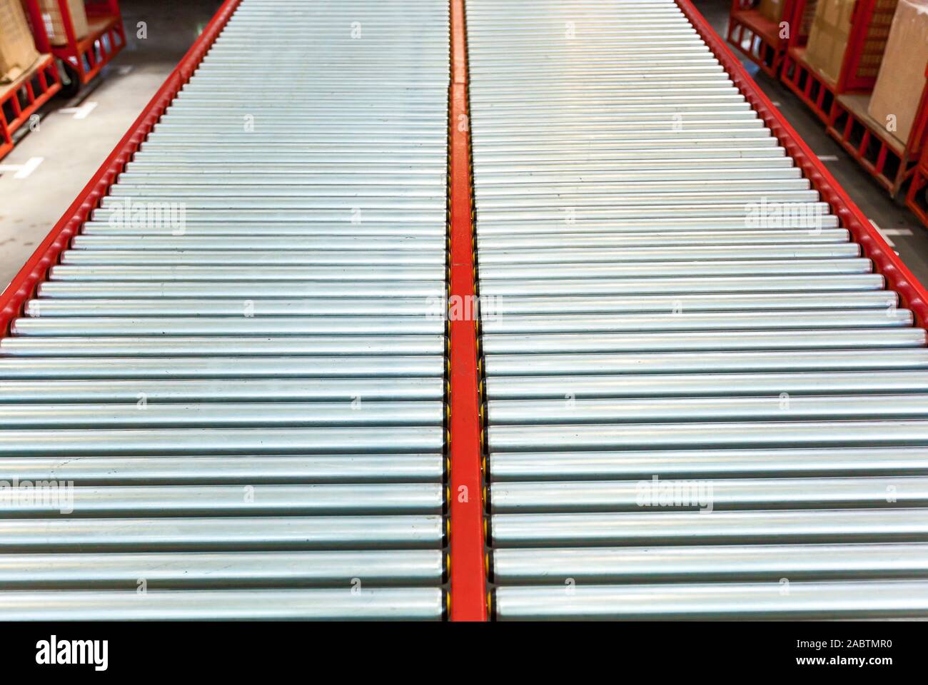 Rotating tracks in white color for moving things at the factory. Contemporary technology for facilitating work. Stock Photo