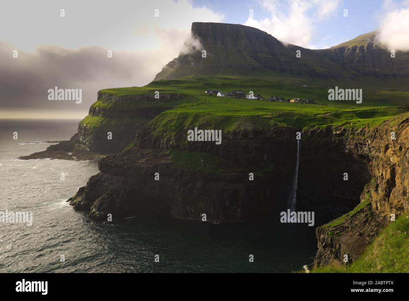 Waterfall of Gasadalur in evening light, the Faroe islands Stock Photo