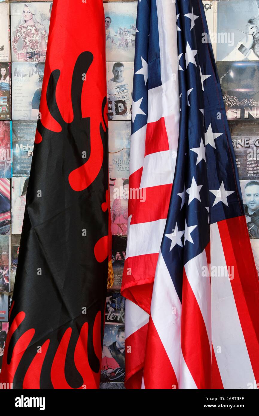 Albanian and American flags in Gjakova, Kosovo. Stock Photo