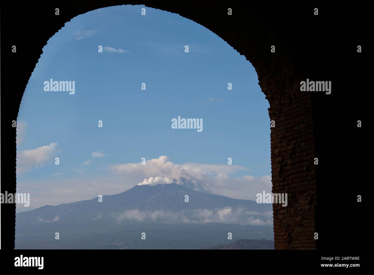 Italy, Sicily, Taormina, Mount Etna with steam escaping from crater Stock Photo