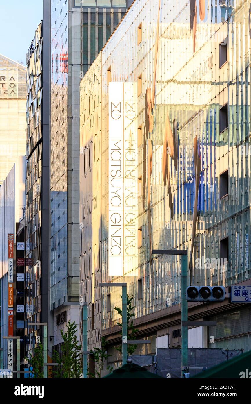 View Along The Matsuya Ginza Department Store With Its S Green Glass Facade Featuring Powerbeats Pro Earphones Display Daytime Golden Hour Stock Photo Alamy