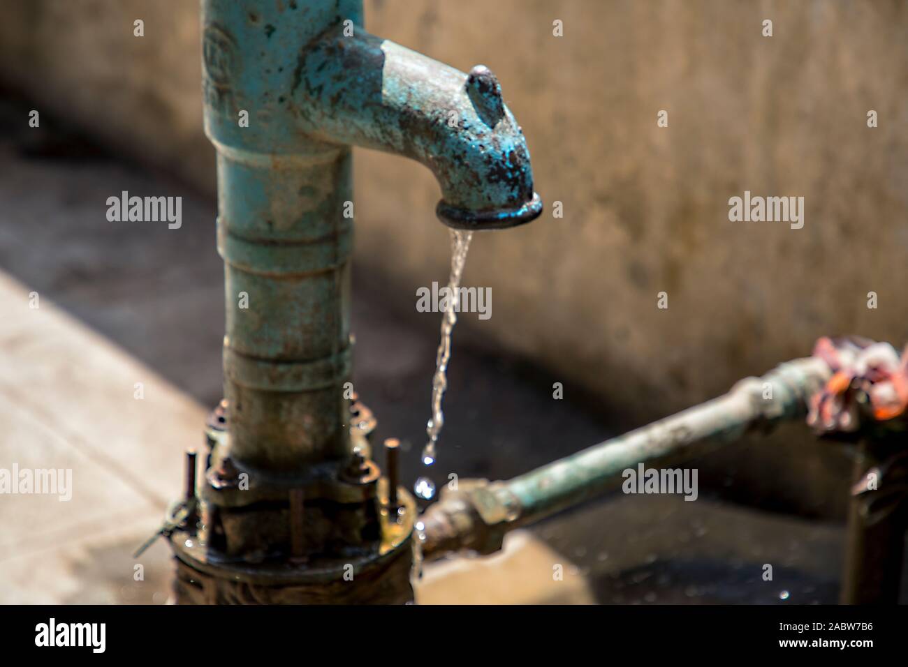 Indian hand pump using to suck and bring ground Stock Photo