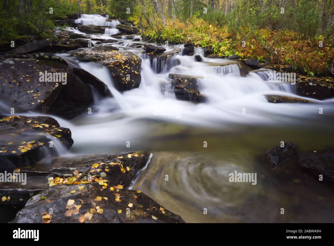 Long exposure photograph of a stream in the autumn, Sweden Stock Photo