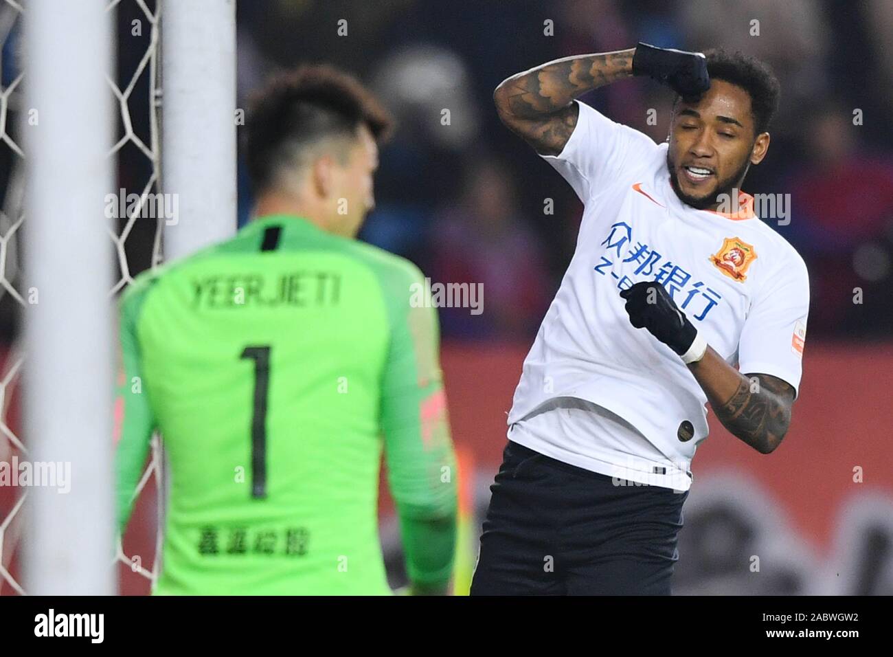 Brazilian football player Rafael Pereira da Silva, commonly known as Rafael or Rafael da Silva, of Wuhan Zall F.C., right, celebrates after scoring a goal during the 29th round match of Chinese Football Association Super League (CSL) against Chongqing SWM in Chongqing, China, 27 November 2019. Chongqing SWM was defeated by Wuhan Zall with 0-1. Stock Photo