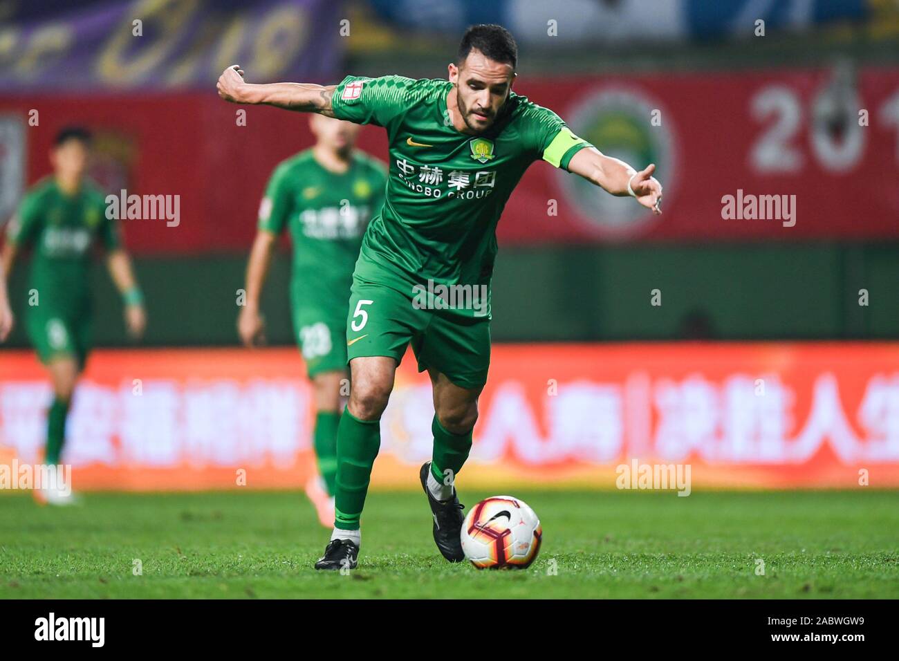 Brazilian football player Renato Soares de Oliveira Augusto, or simply Renato Augusto, of Beijing Sinobo Guoan F.C. passes the ball during the 29th round match of Chinese Football Association Super League (CSL) against Guangzhou R&F in Guangzhou city, south China's Guangdong province, 27 November 2019. Guangzhou R&F slashed by Beijing Sinobo Guoan with 1-4. Stock Photo