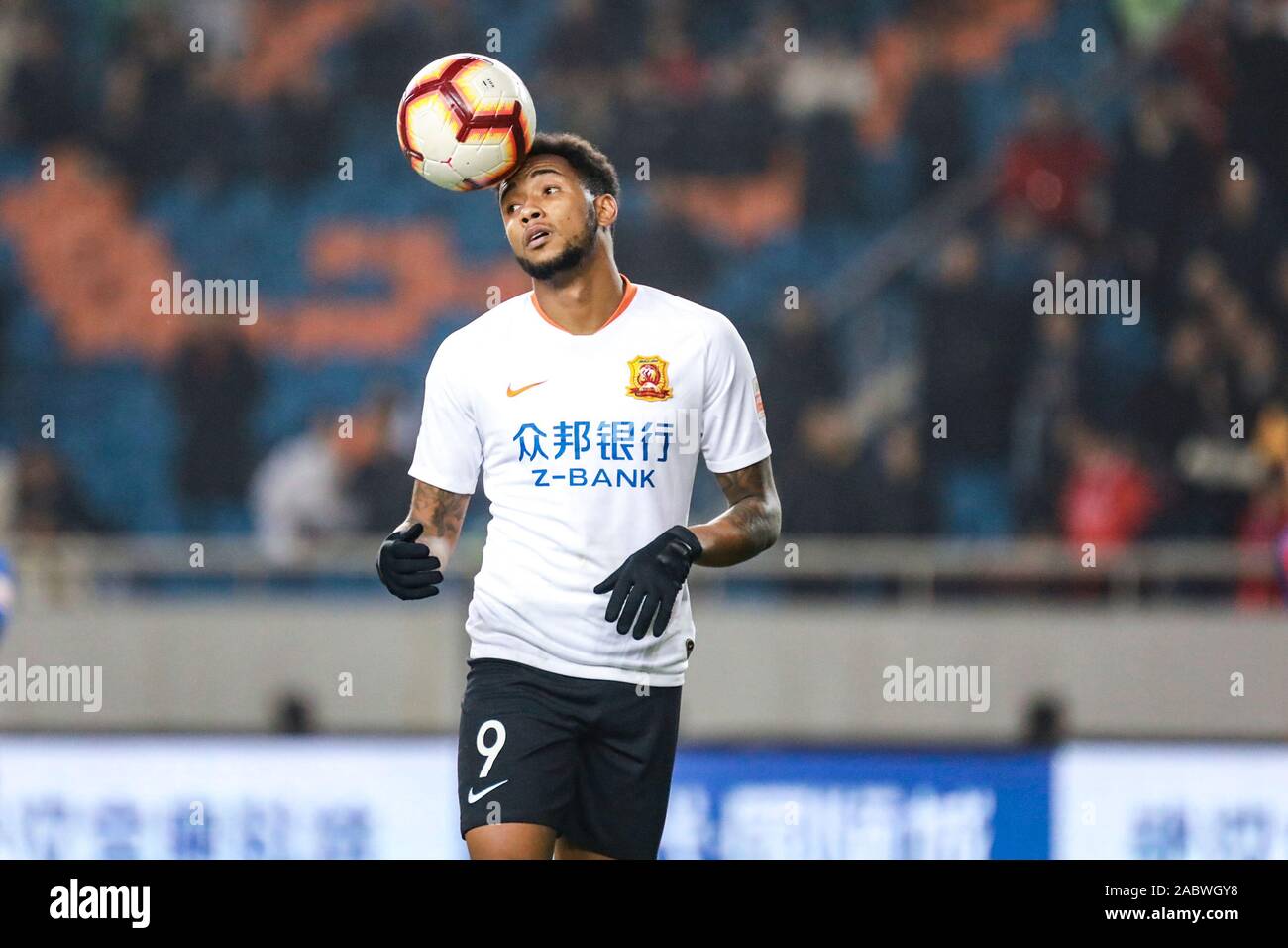 Brazilian football player Rafael Pereira da Silva, commonly known as Rafael or Rafael da Silva, of Wuhan Zall F.C. keeps the ball during the 29th round match of Chinese Football Association Super League (CSL) against Chongqing SWM in Chongqing, China, 27 November 2019. Chongqing SWM was defeated by Wuhan Zall with 0-1. Stock Photo