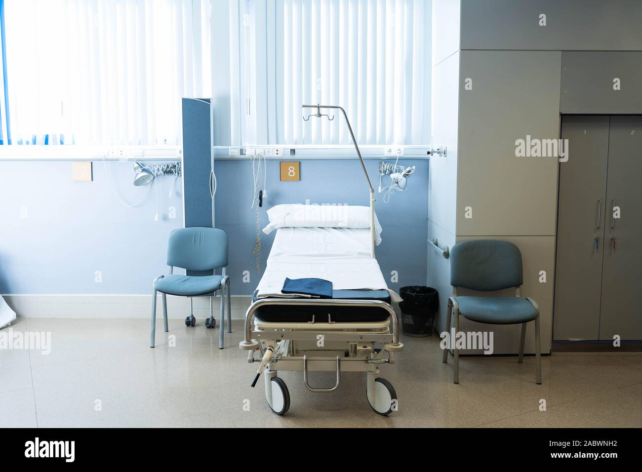 Hospital room with bed and medical equipment Stock Photo