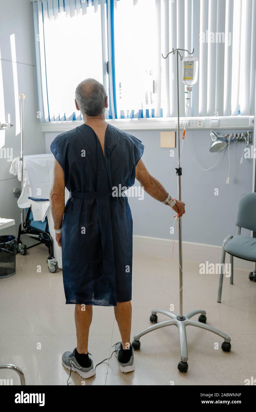 senior man plus year old man recovering from surgery in a hospital bed. Stock Photo