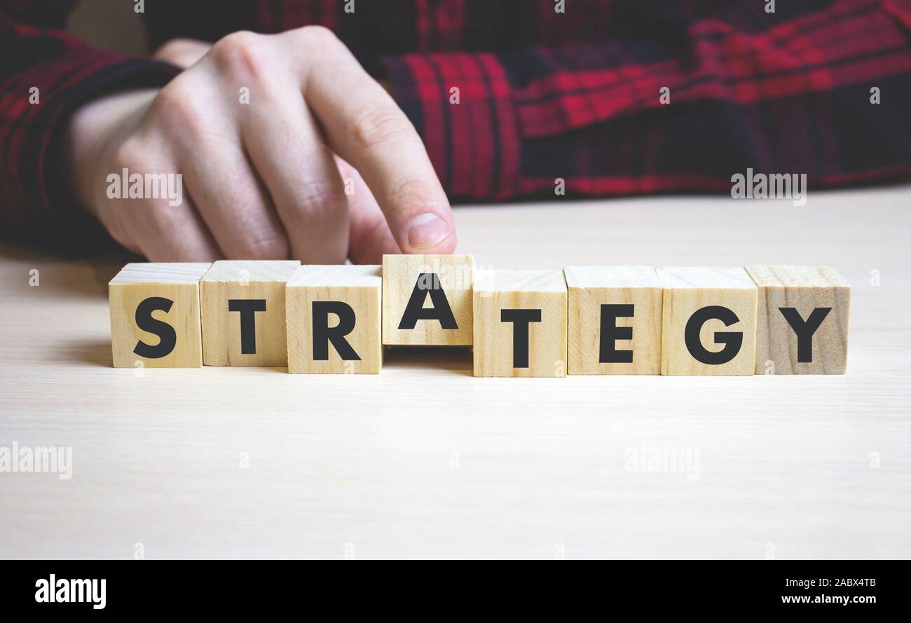 the word strategy on wooden block - business concept, businessman ...