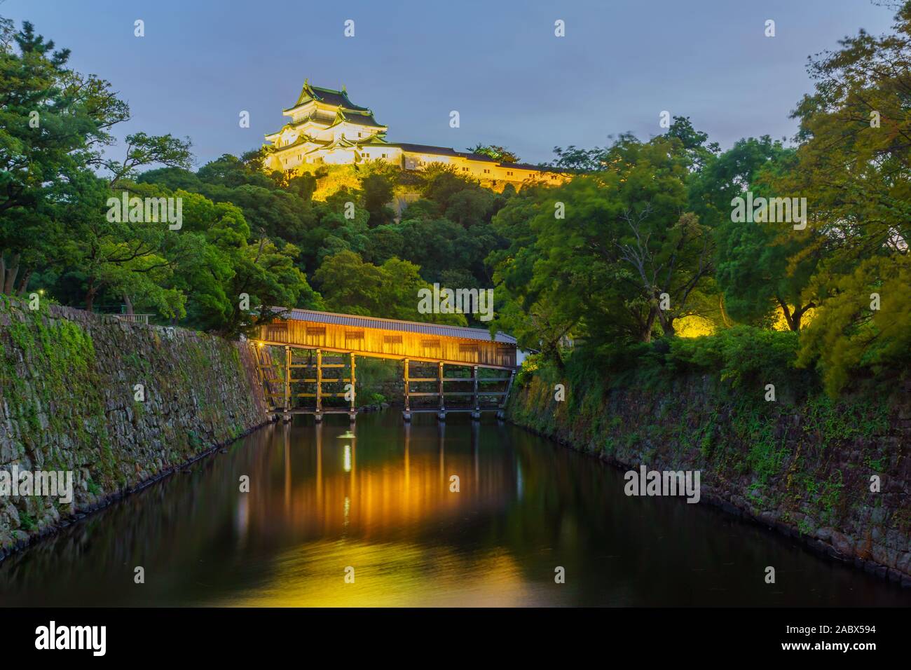Evening view of the Wakayama castle and the Ohashirouka Covered Bridge, in Wakayama City, Japan Stock Photo