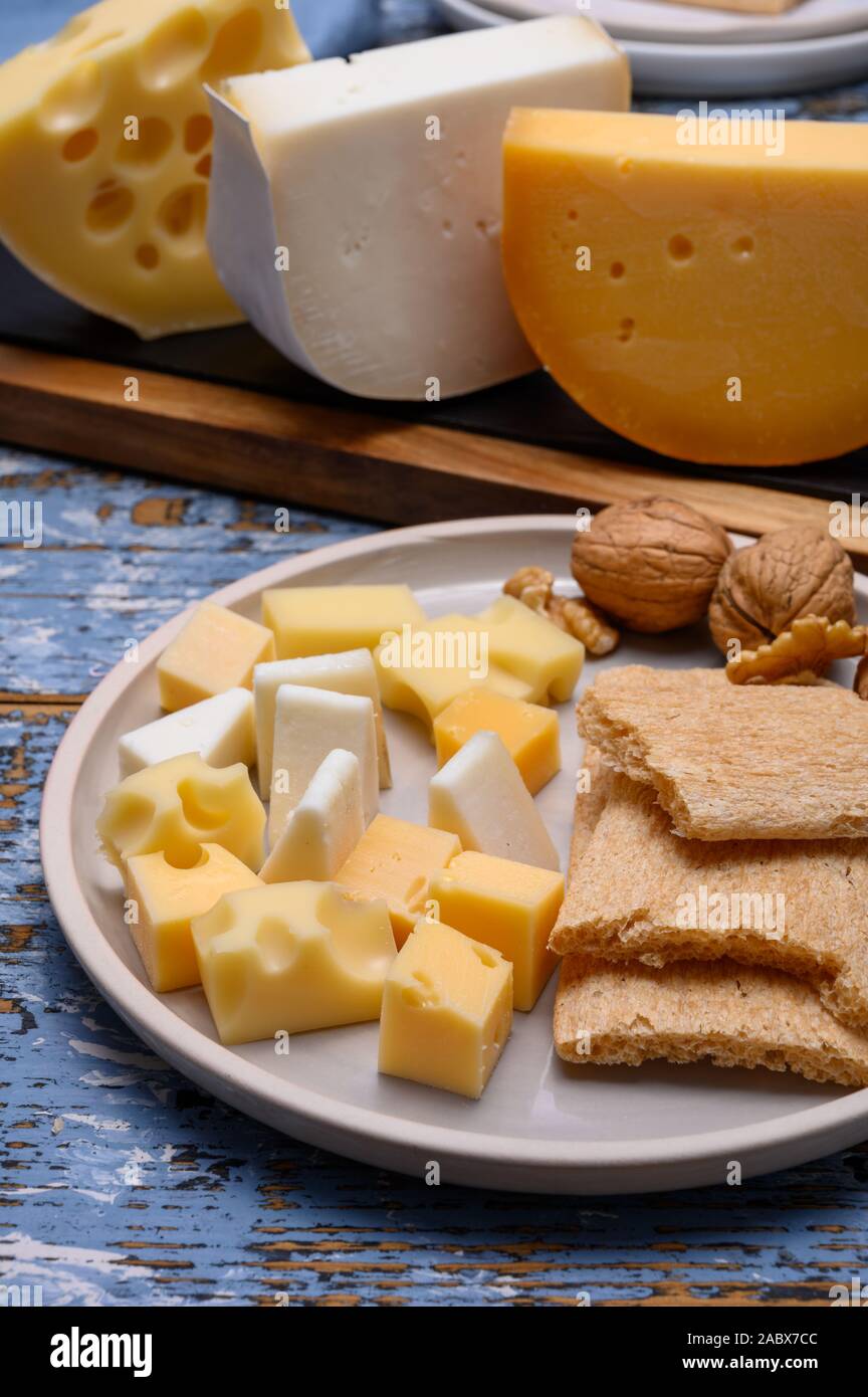 Tasty snacks, cheese blocks from Dutch yellow gouda and white goat hard