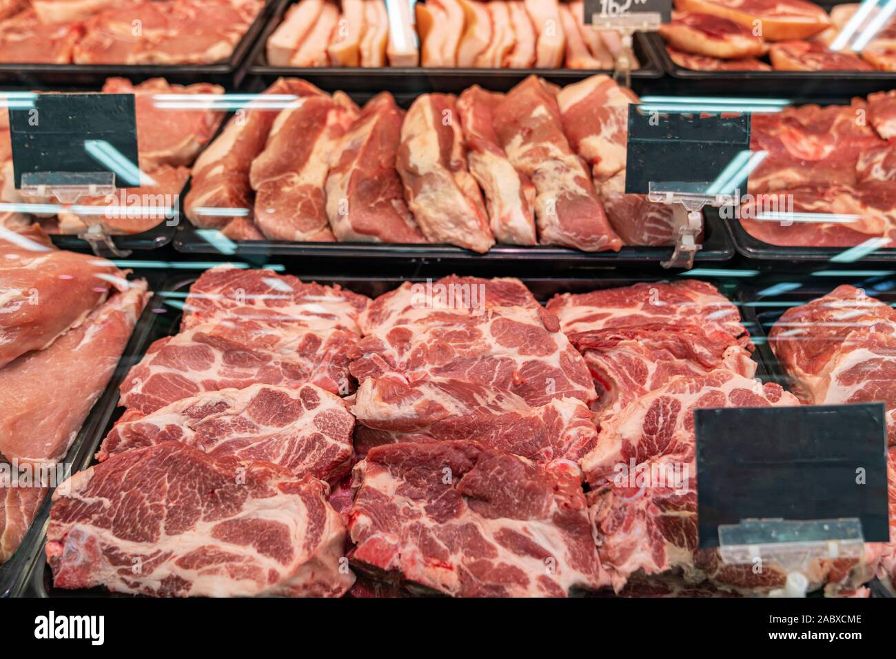 Selection of quality meat at a butcher shop, butchered pork in a