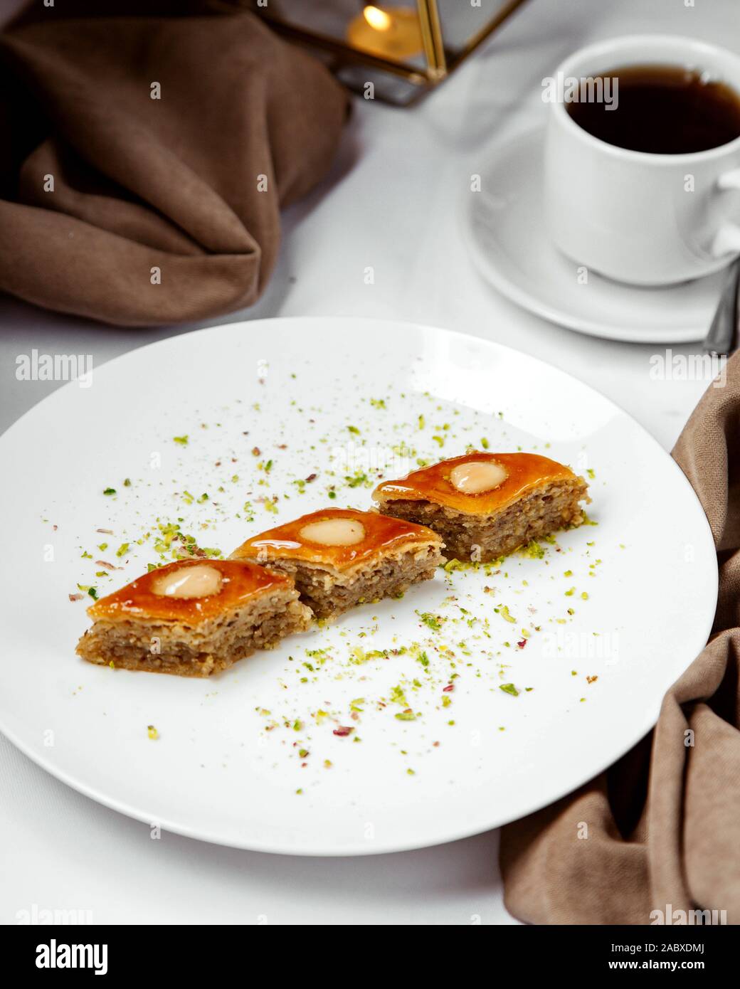 three pieces of azerbaijani pakhlava multilayered dessert Stock Photo