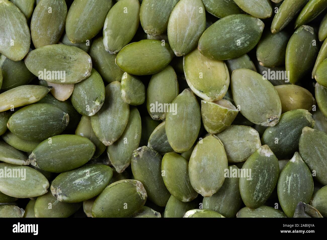 Macro photograph of green dried pumpkin seeds Stock Photo