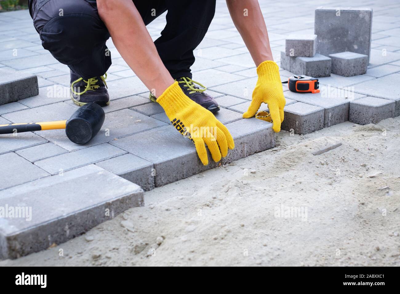 laying patio slabs on sand and cement