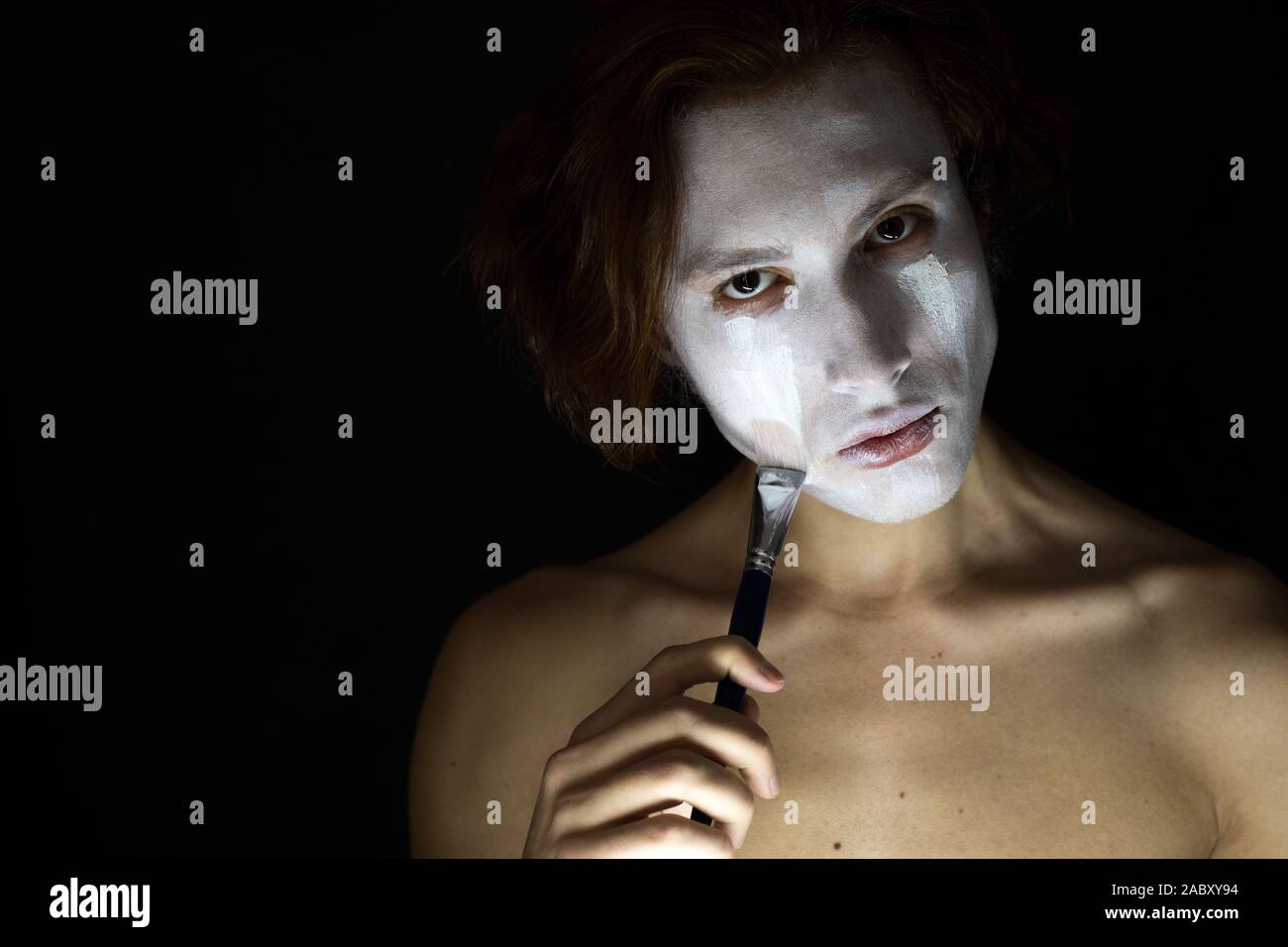 Man gets white paint on the face Stock Photo Alamy