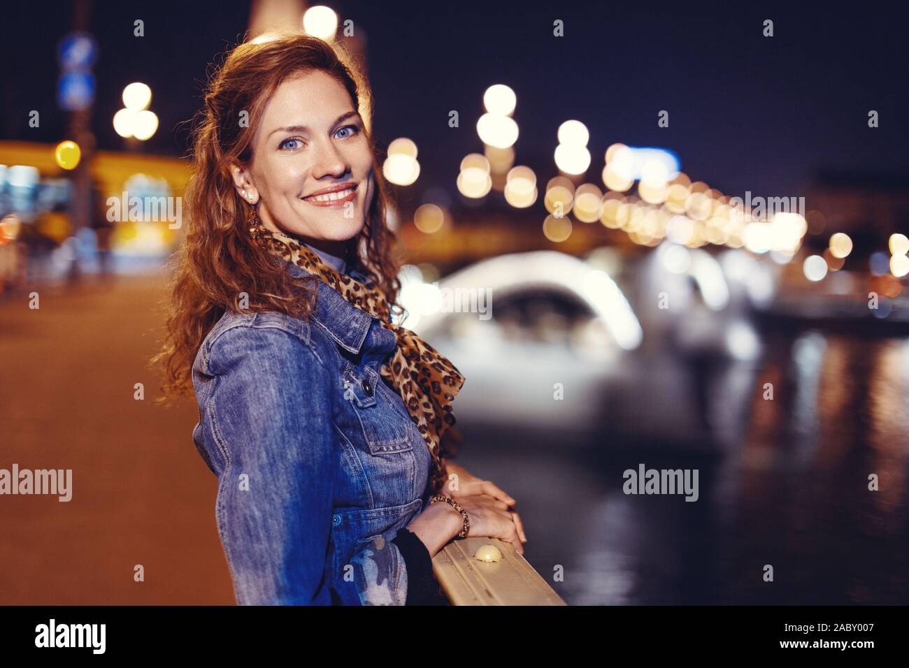 https://c8.alamy.com/comp/2ABY007/young-hungarian-woman-smiling-on-margaret-bridge-at-night-budapest-hungary-2ABY007.jpg