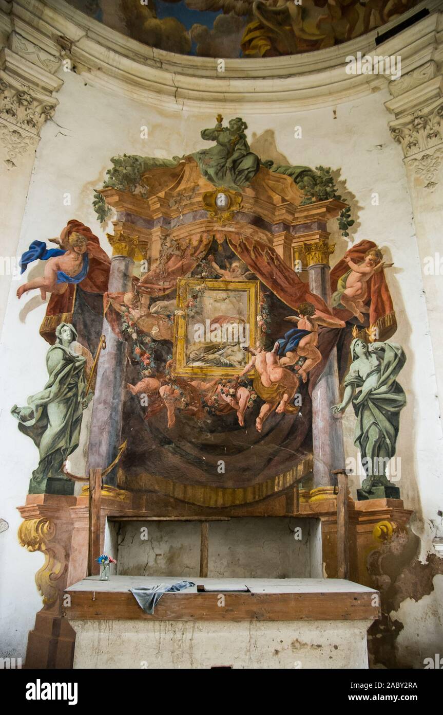 Painted altar of the chapel in the Sarny Palace built in 1661 in Sarny from the reconstruction of the Renaissance manor, made by the von Götzen family Stock Photo